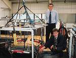 Sonardyne Marketing Co-ordinator David Brown (standing) and Sales Director Richard Binks show tank-testing set-up for SIPS transponders