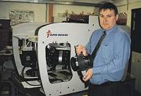 Sub-Atlantic's Scott Jamieson displays the company's new drop-down camera system, with a Super Mohawk as a back-drop